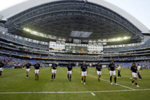 Cavalry FC and Atlético Ottawa competing in a Canadian Premier League fixture with fans in the stadium.