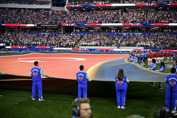 FIFA Volunteer 2026 volunteers assisting football fans at a World Cup stadium